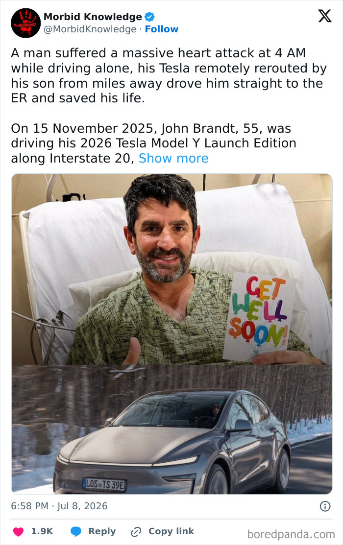 A man who suffered a heart attack with his Tesla that saved his life. He is in hospital bed holding a get well soon card.