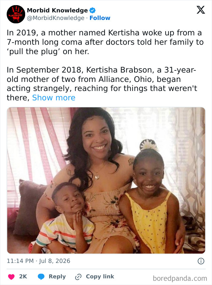 A mother who woke up from a 7-month coma, smiling with her two young children.