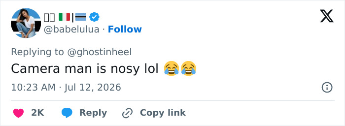 A tweet from babelulua with flags in the username, commenting on the cameraman's nosiness at the viral World Cup moment. A tweet from babelulua with flags in the username, commenting on the cameraman's nosiness at the viral World Cup moment.