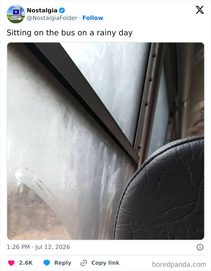 A blurry image looking out a bus window on a rainy day, capturing a moment of nostalgia from everyday life.