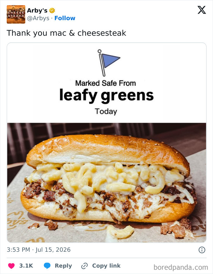 A funny and unhinged Arbys tweet showing a mac and cheesesteak, marked safe from leafy greens.
