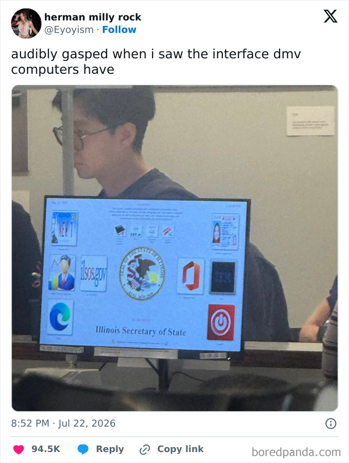 A funny tweet showing a DMV computer interface that looks like a retro desktop. A person is visible in the background.