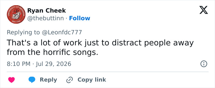 A tweet by Ryan Cheek about Katy Perry's bizarre stunt, implying it's a distraction from horrific songs.