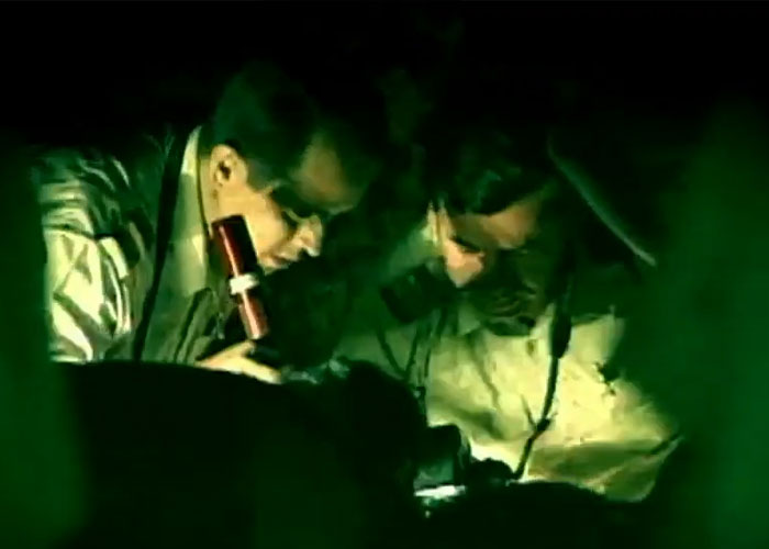 Two men in uniforms search for a disappeared man in a dark environment, highlighting the horrific fate.