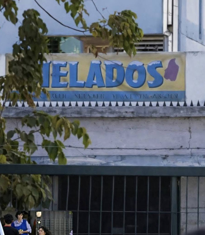 A building with the word HIELADOS on a sign, central to the disappeared man and his horrific fate.