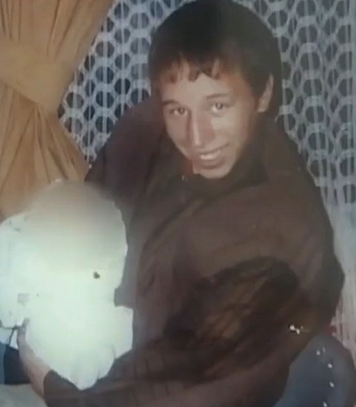 Boy with a large white object, whose disappearance led to a horrific fate revealed by a stray dog.