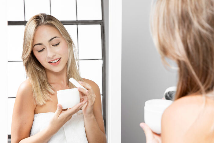 Woman opening a beauty product container, among items that swapped audiences.
