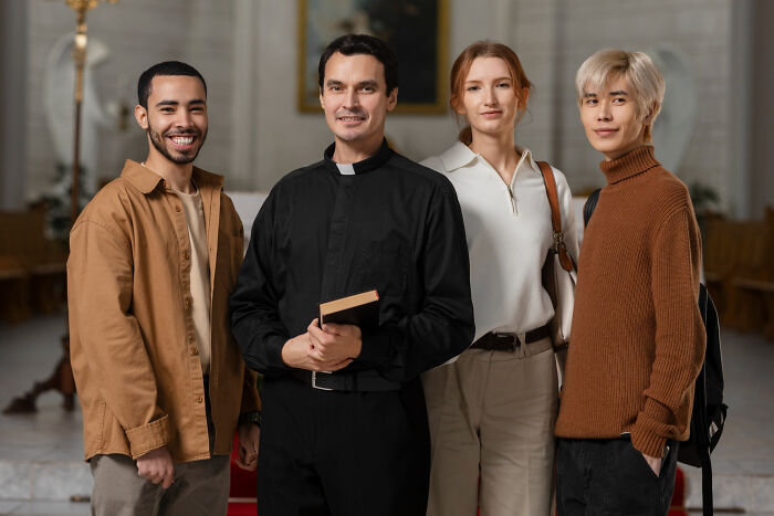 A group including a priest, illustrating jobs guys have that make women swipe left.