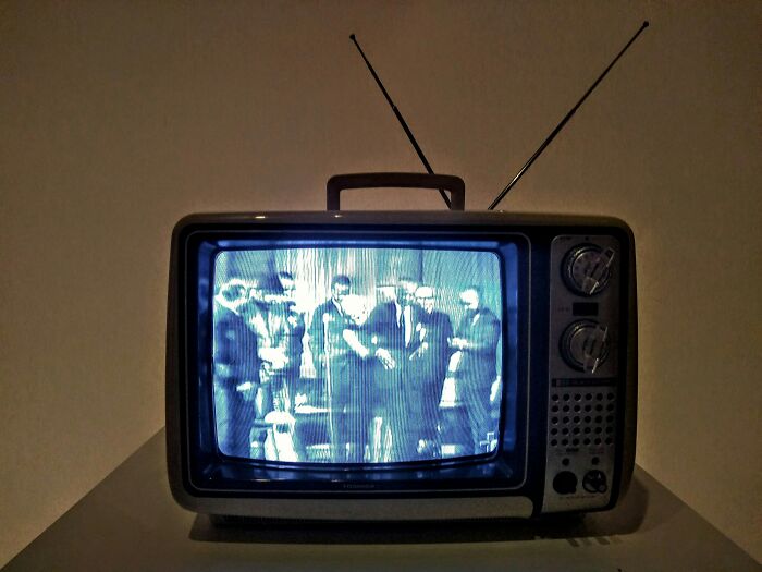 An old television displaying a black and white image, evoking nostalgia for questions kids asked in the past.