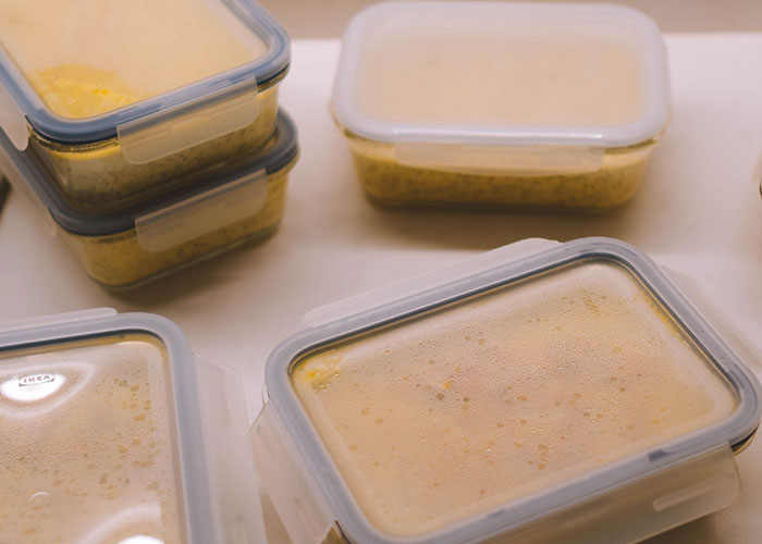 Food in clear containers, representing the prepared bags for women who had to leave immediately.