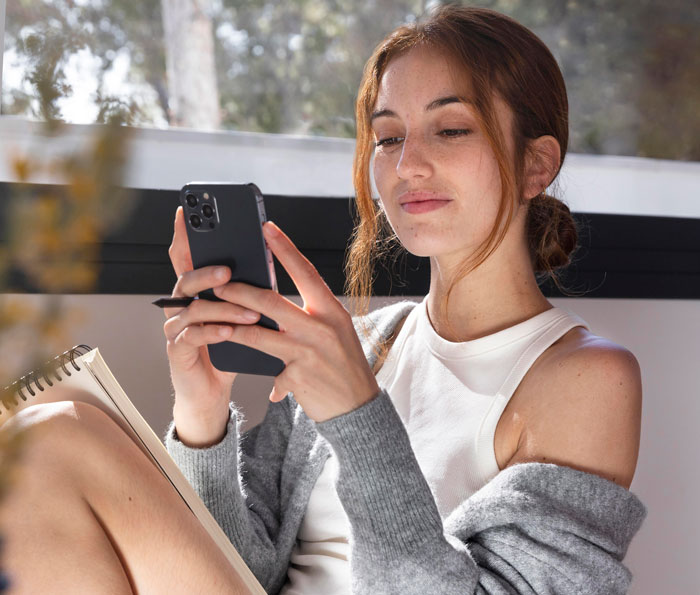 Image shows a woman distracted by her phone, illustrating the cheating wife's contact with the other man. Image shows a woman distracted by her phone, illustrating the cheating wife's contact with the other man.