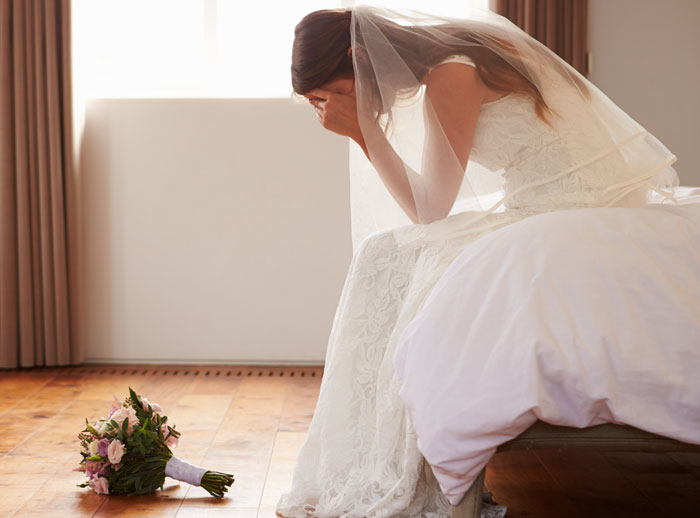 A crying bride on her wedding day, upset that the groom may vanish before the big day. A crying bride on her wedding day, upset that the groom may vanish before the big day.