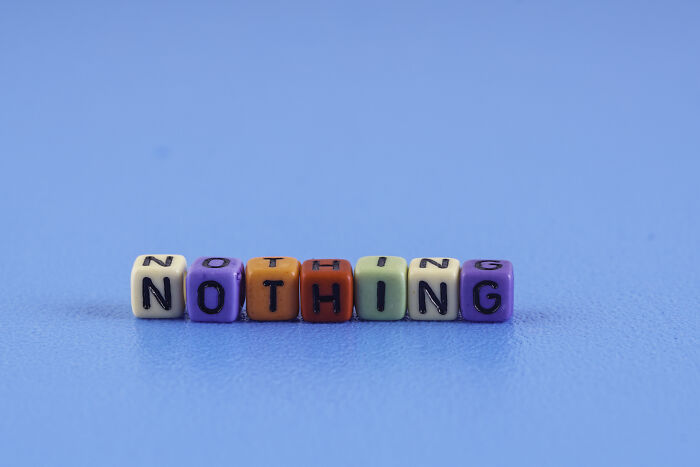 Colorful letter blocks spelling NOTHING on a blue background, symbolizing kids questions that stump parents.