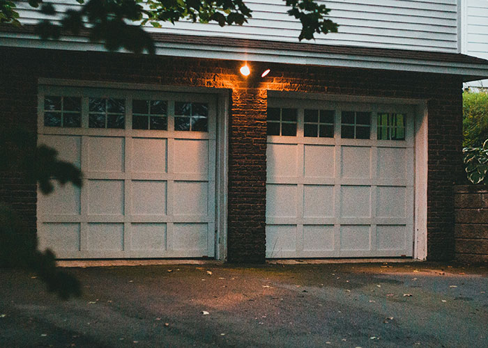 Two garage doors at a house, symbolizing the first time women arrive and leave a man's home immediately.