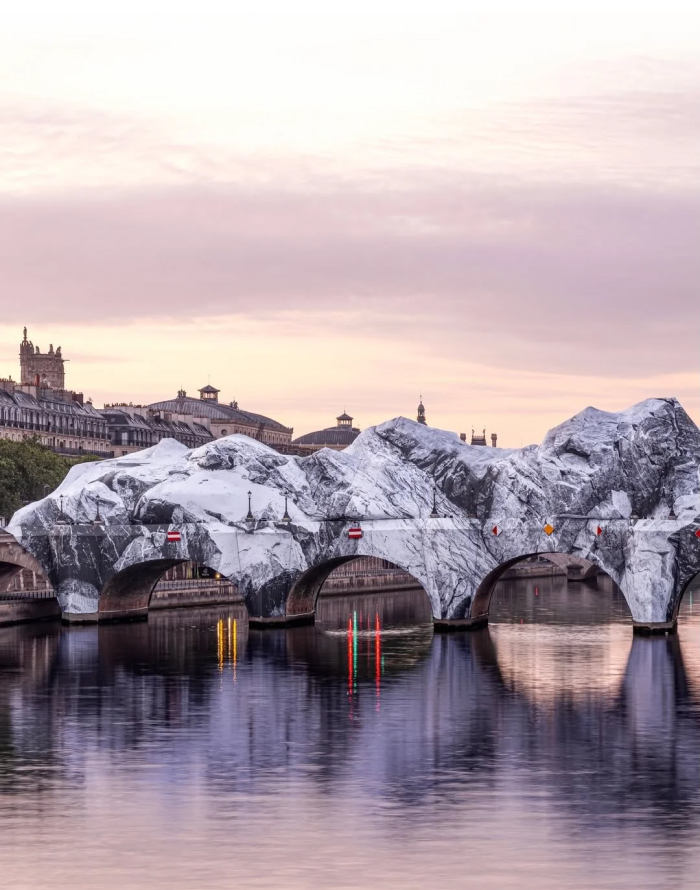 An artistic bridge resembling snow-capped mountains over water, featuring beautiful modern architecture designs.