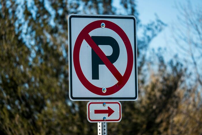 A no parking sign, representing the baffling questions kids asked that stumped parents.