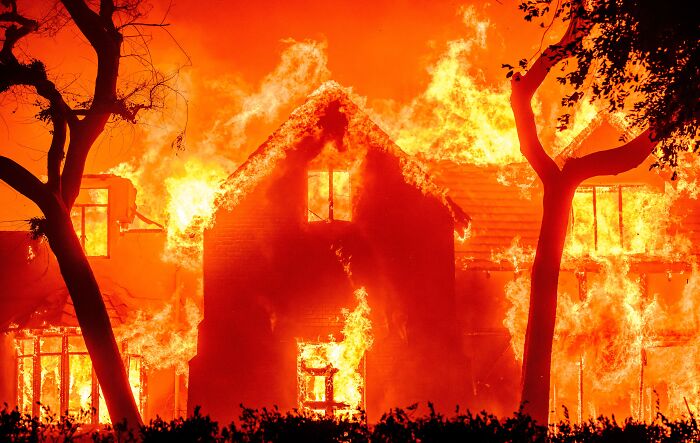 A house engulfed in terrifying flames at night, a moment that still haunts people.