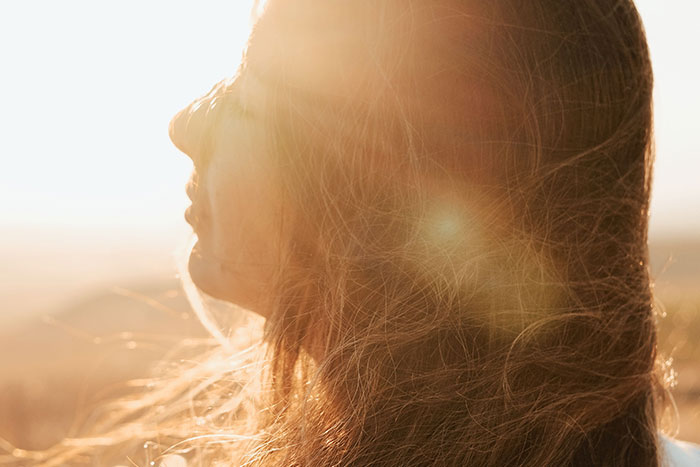 Woman with sun-kissed hair, illustrating the diverse backgrounds of kids with unfortunate names.