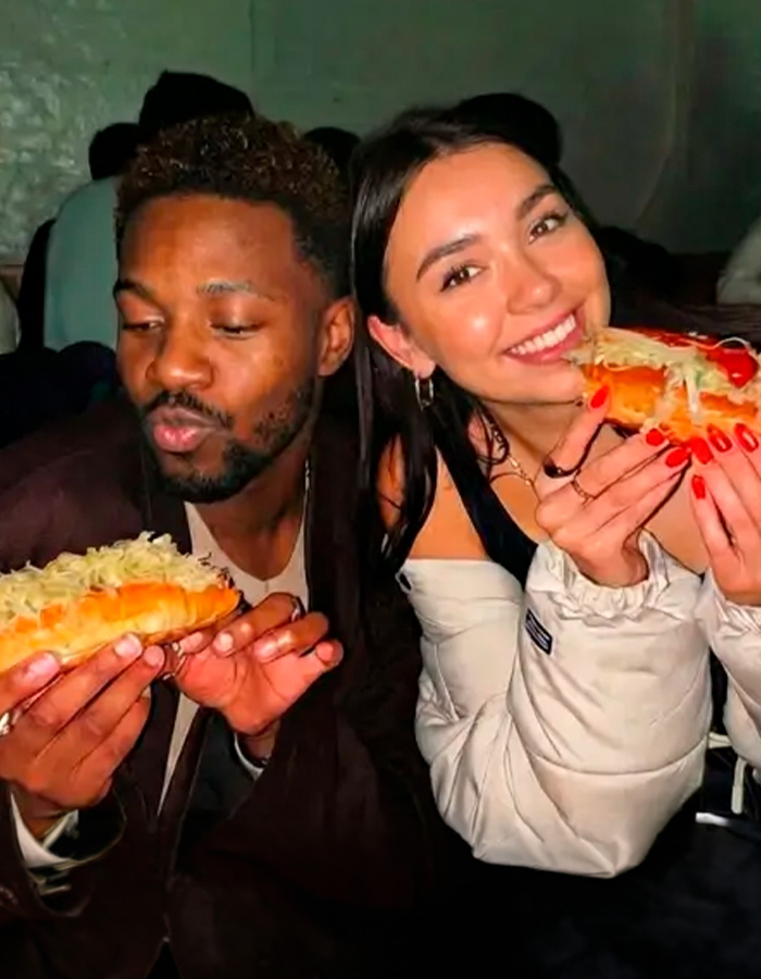 Happy college students enjoying food, showcasing the new dating method's social appeal over Tinder. Happy college students enjoying food, showcasing the new dating method's social appeal over Tinder.