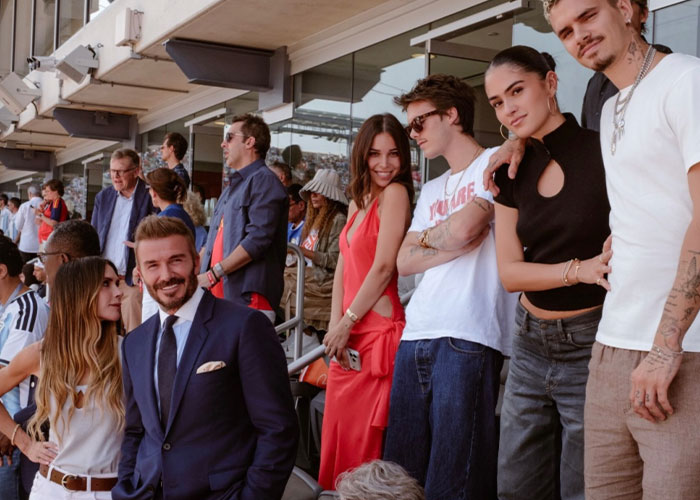 David Beckham smiles at the World Cup while Victoria Beckham and family members enjoy the event. David Beckham smiles at the World Cup while Victoria Beckham and family members enjoy the event.