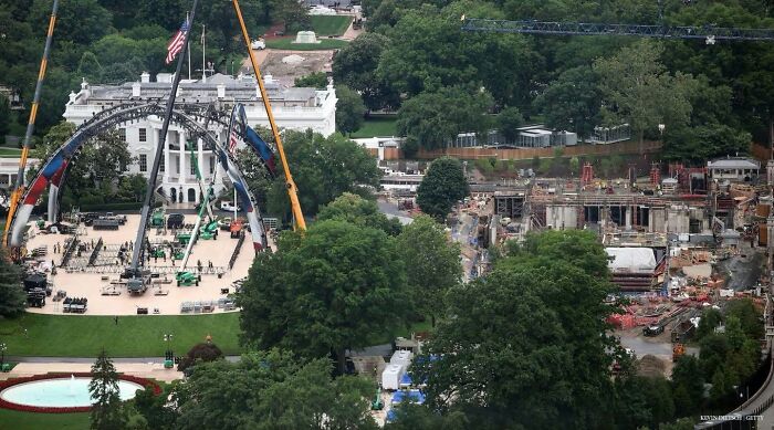 Aerial view of the White House surrounded by construction cranes and equipment, showing America's cultural decline.