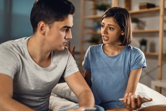 A distressed woman speaks to a man, symbolizing the turmoil a man faces with an autism diagnosis and his wife's change of mind about kids. A distressed woman speaks to a man, symbolizing the turmoil a man faces with an autism diagnosis and his wife's change of mind about kids.