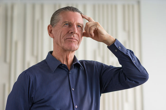 A man thinking, representing the thoughtful process related to a MIL turning pregnancy into a competition. A man thinking, representing the thoughtful process related to a MIL turning pregnancy into a competition.