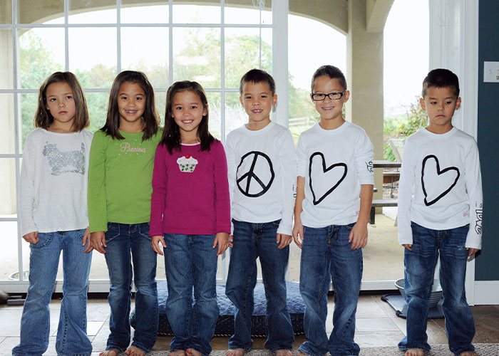 Collin Gosselin and siblings, standing in a row, as public battle intensifies.