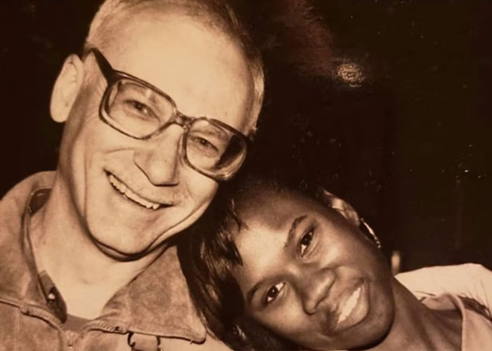 A man and a woman smiling for a sepia-toned photo, linked to the slain track star's story. A man and a woman smiling for a sepia-toned photo, linked to the slain track star's story.