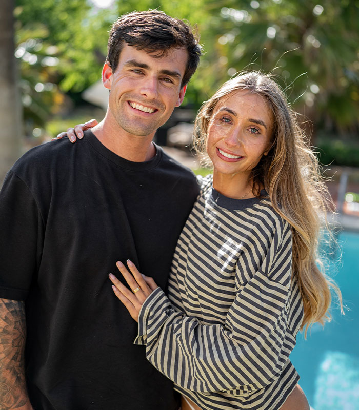 Adult star Lily Phillips and her boyfriend smiling together outdoors, discussing their relationship. Adult star Lily Phillips and her boyfriend smiling together outdoors, discussing their relationship.
