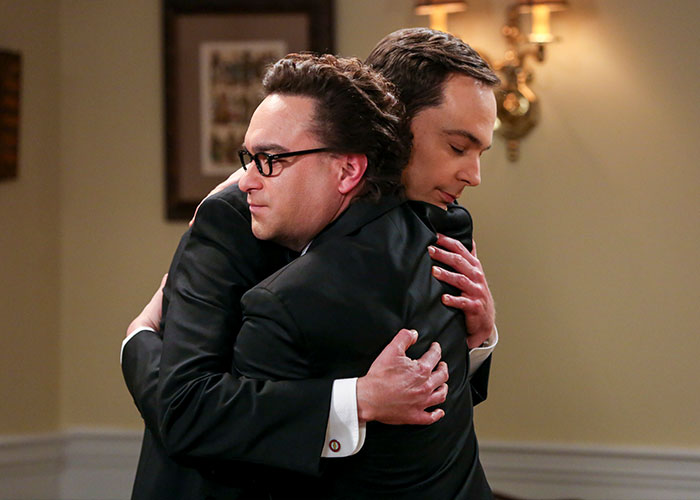 Jim Parsons hugging another actor from The Big Bang Theory, illustrating the personal price and bond formed on the show for the star. Jim Parsons hugging another actor from The Big Bang Theory, illustrating the personal price and bond formed on the show for the star.
