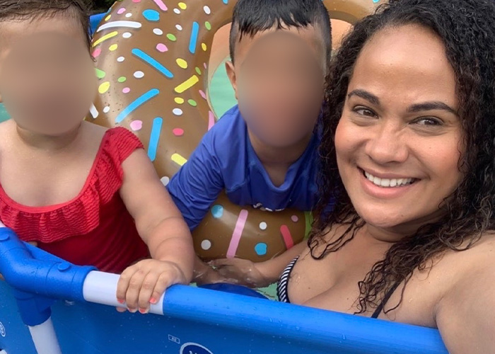 Mom in a pool with her two children, highlighting the marshmallow accident that took her life.