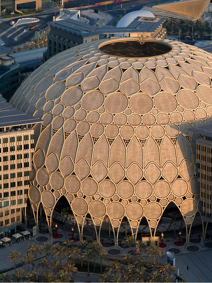 Modern Architecture Designs: A large, domed building with intricate geometric patterns, showcasing beautiful modern architecture.
