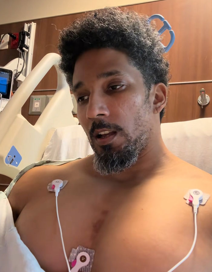 Man with medical sensors on his chest, in a medical situation, needing a transplant, due to dangers of plants.
