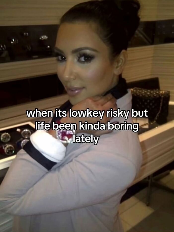 A relatable meme of Kim Kardashian looking glamorous with text about taking risks when life is boring.