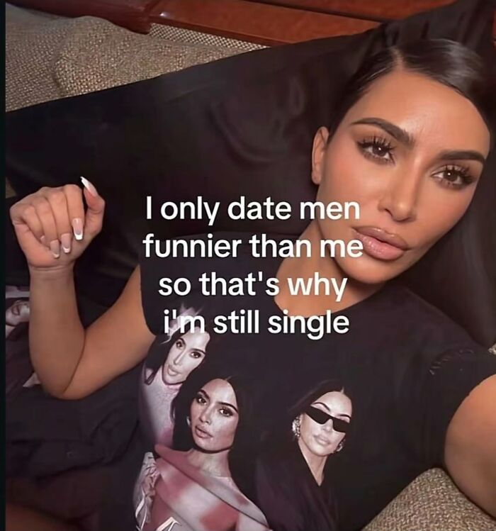 A humorous and relatable meme of Kim Kardashian wearing a t-shirt with her own images, stating she only dates funnier men.