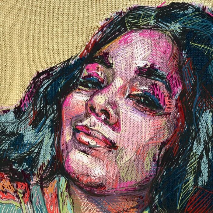 A striking knitted portrait of a woman with dark hair, highlighting the innovative use of traditional knitting in modern art.