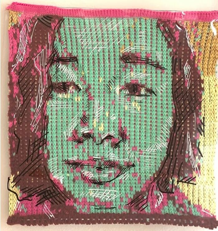 A unique modern art knitted portrait of a woman with long hair, showcasing the blend of knitting and contemporary design.