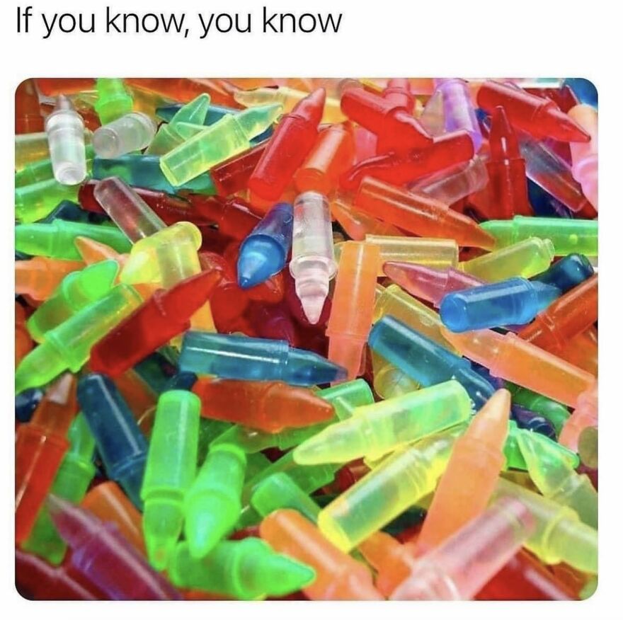 A pile of colorful plastic bullet-shaped candy containers, a familiar sight for 90s babies.