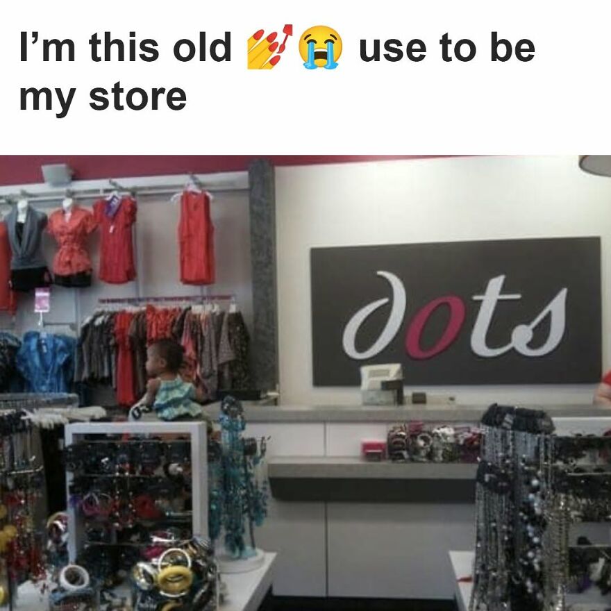 A baby sitting in a Dots store, a '90s babies retail memory.