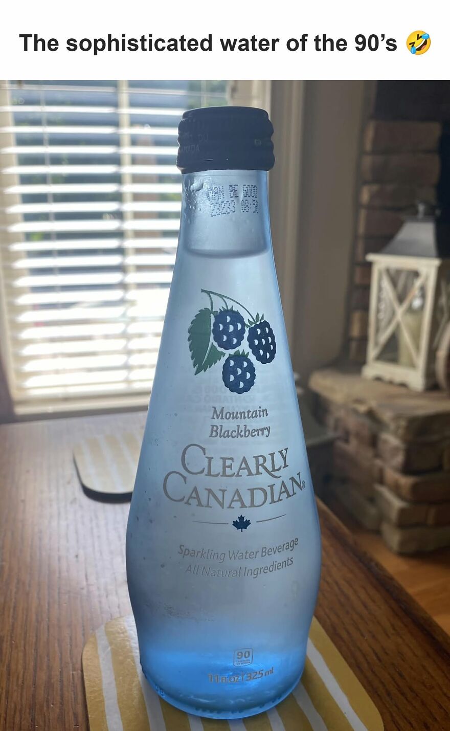 A bottle of Clearly Canadian Mountain Blackberry sparkling water, a nostalgic drink for 90s babies.