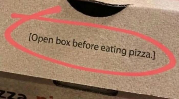 A pizza box with a ridiculous instruction: Open box before eating pizza, showing cultural decline.
