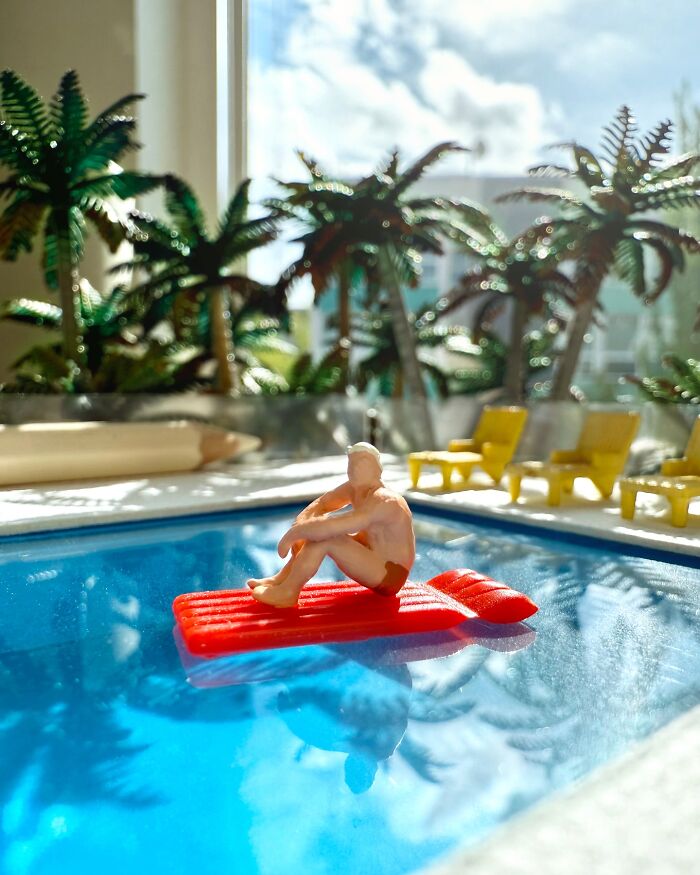 Artist Derrick Lin creates miniature diorama sets, featuring a person relaxing on an inflatable raft in a pool.