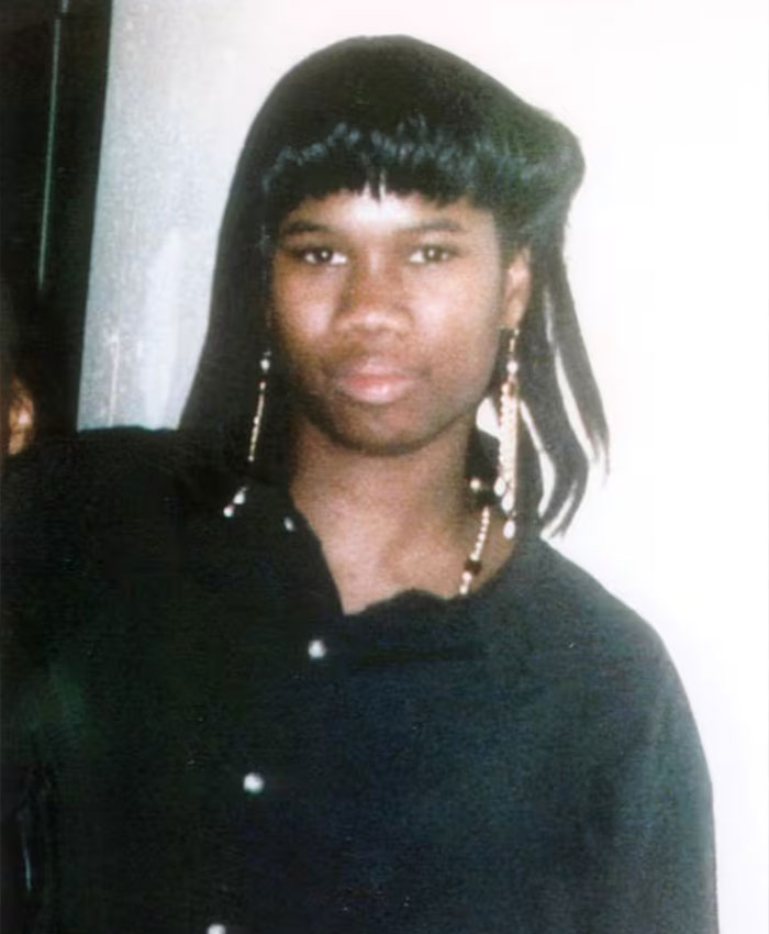 A young woman, the rising track star, posing for a photo with long earrings, pursuing her Olympic dreams. A young woman, the rising track star, posing for a photo with long earrings, pursuing her Olympic dreams.
