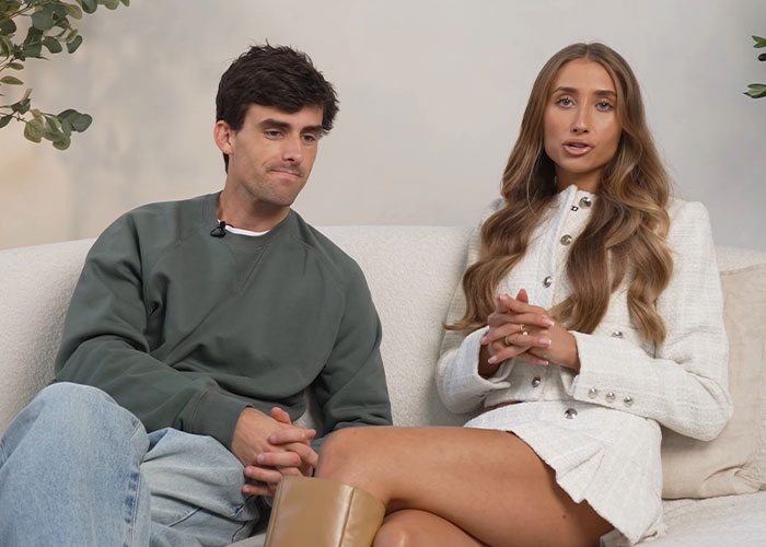 Adult star Lily Phillips and her boyfriend sitting on a couch, engaged in conversation for an interview. Adult star Lily Phillips and her boyfriend sitting on a couch, engaged in conversation for an interview.
