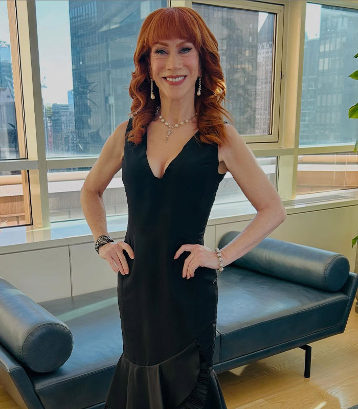 A star in her 60s, with fiery red hair, wearing a black dress, posing indoors, revealing her relationship. A star in her 60s, with fiery red hair, wearing a black dress, posing indoors, revealing her relationship.