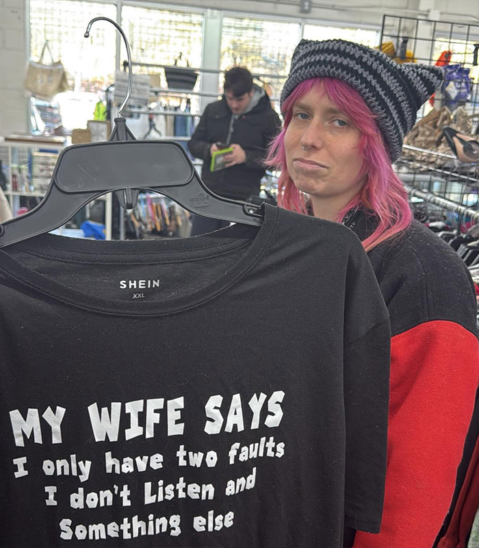 Canadian woman with pink hair in a store, holding a shirt, accused of slapping Jersey Shore teen.