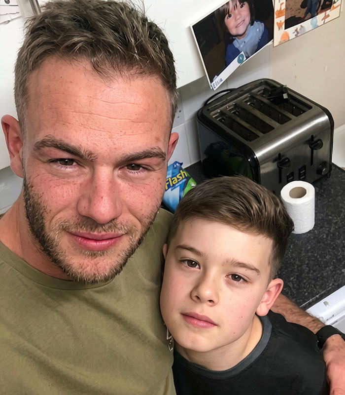 A man with a younger child, possibly a father and son, from the controversial content creators. A man with a younger child, possibly a father and son, from the controversial content creators.