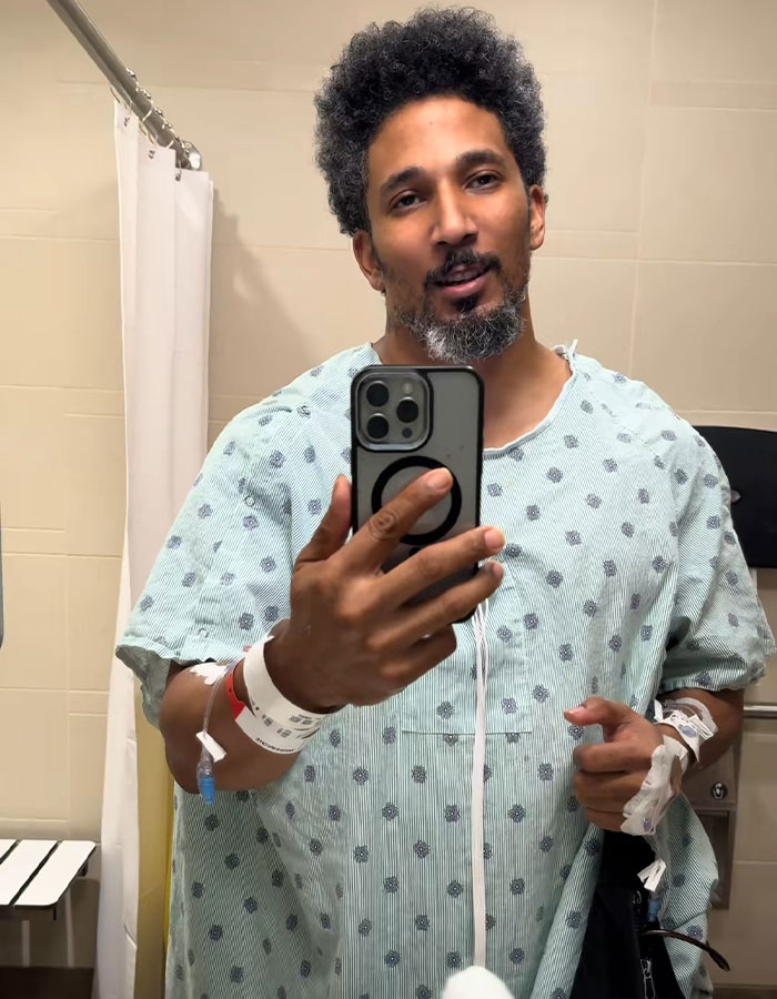 Man in a hospital gown taking a selfie, in a dire medical situation, needing a transplant due to plants.