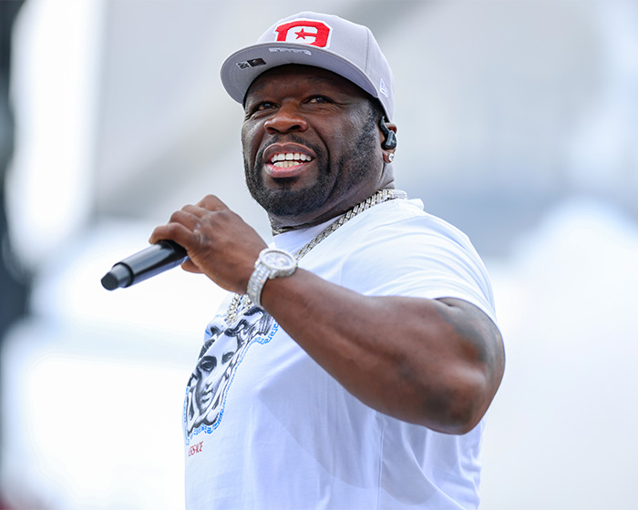 50 Cent performing on stage. One of the celebrity mysteries that are still unsolved.